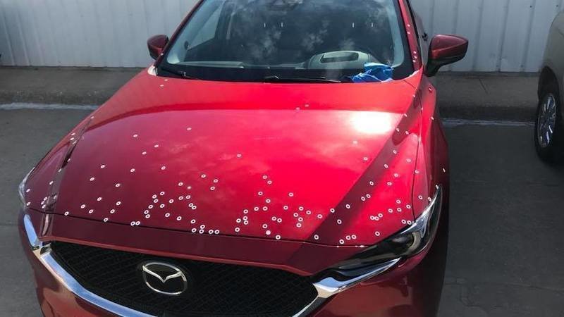 red mazda with chipping paint